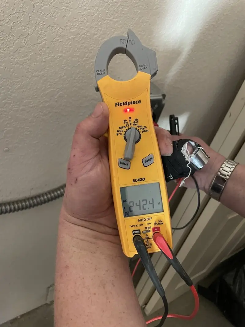 Voltage testing with clamp meter during Hot Tub / Pool Electrical Wiring in Goodland